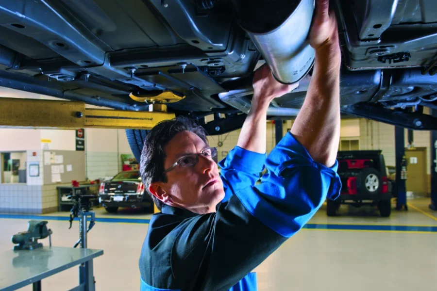 Service technician under a car